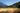 Man hiking through woods down trail